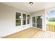 Covered back deck features wood flooring and great views of the property at 292 Weddington Way, Benson, NC 27504