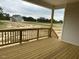 Exterior view of a spacious wooden deck overlooking the yard, perfect for outdoor living at 292 Weddington Way, Benson, NC 27504