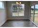 Bright dining room with large windows and stylish chandelier, allowing ample natural light at 292 Weddington Way, Benson, NC 27504