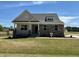 Charming single-Gathering home with a stone facade and a covered porch in a beautiful community at 292 Weddington Way, Benson, NC 27504