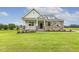 Beautiful home boasts a manicured lawn and an inviting entrance at 292 Weddington Way, Benson, NC 27504