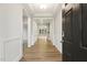 Spacious hallway featuring hardwood floors and elegant trim work at 292 Weddington Way, Benson, NC 27504