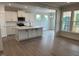 Modern kitchen with stainless steel appliances and a spacious island with seating at 292 Weddington Way, Benson, NC 27504