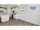 An eat-in kitchen with white cabinets, new appliances, and durable flooring at 292 Weddington Way, Benson, NC 27504