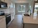Well-equipped kitchen featuring stainless steel appliances, a large island, and ample counter space at 292 Weddington Way, Benson, NC 27504