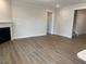 Bright and spacious living room with a fireplace, and neutral finishes, perfect for relaxation at 292 Weddington Way, Benson, NC 27504