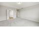 The main bedroom offers a tray ceiling, carpet, and easy access to the ensuite bathroom at 292 Weddington Way, Benson, NC 27504