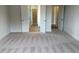 Spacious main bedroom with ensuite bathroom, closet and soft carpeting at 292 Weddington Way, Benson, NC 27504