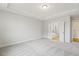 Carpeted primary bedroom boasts a tray ceiling and ensuite bathroom with double doors at 292 Weddington Way, Benson, NC 27504