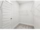 Walk-in closet boasts shelving and a door at 292 Weddington Way, Benson, NC 27504