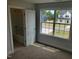 Bedroom with a view through the window, and a bathroom with a bathtub at 308 Whispering Way, Sanford, NC 27330