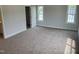 Bedroom showcasing plush carpeting, neutral walls, a closet, and natural light from windows at 308 Whispering Way, Sanford, NC 27330