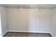 Walk-in closet featuring neutral walls, base trim, plush carpeting, and shelving ready for storage solutions at 308 Whispering Way, Sanford, NC 27330