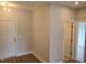 Cozy entryway featuring hardwood floors, white trim, and a view of the hallway at 308 Whispering Way, Sanford, NC 27330