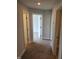 Hallway highlighting neutral walls, carpet flooring, and doorways leading to other rooms in the home at 308 Whispering Way, Sanford, NC 27330