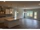 Open-concept kitchen featuring a large island, modern pendant lights, and stainless steel appliances at 308 Whispering Way, Sanford, NC 27330