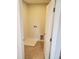 A tiled laundry room features connections and space for a washer and dryer, ready for appliance installation at 308 Whispering Way, Sanford, NC 27330