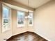 Bright dining area with hardwood floors and a bay window at 313 Springtooth Dr, Zebulon, NC 27597