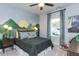 Cozy bedroom with a nature-themed wall mural and ample natural light at 3395 Mission Olive Pl, New Hill, NC 27562