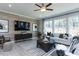 Living room with a neutral color scheme and a large TV at 3395 Mission Olive Pl, New Hill, NC 27562