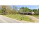 Ranch house with a long driveway and mailbox at 3600 Nc 561, Louisburg, NC 27549