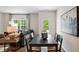 Dining area with dark wood table and access to backyard at 446 Belgian Red Way, Wake Forest, NC 27587