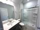 Bathroom featuring a walk-in shower and double sink vanity with a large mirror at 45 Calabria Ct, Franklinton, NC 27525