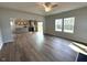 Open concept living and dining with kitchen featuring stainless appliances, island, and sliding glass doors to deck at 45 Calabria Ct, Franklinton, NC 27525