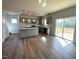 Bright kitchen featuring hardwood floors, stainless appliances, and a sliding door leading to a deck at 45 Calabria Ct, Franklinton, NC 27525