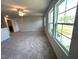 Open living room with carpet, bright windows, and views of the neighborhood at 45 Calabria Ct, Franklinton, NC 27525