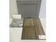 Close up of gray cabinet door with swatches for countertop and vinyl driftwood flooring at 45 Calabria Ct, Franklinton, NC 27525