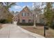 Brick two-story house with driveway and landscaping at 5040 Darcy Woods Ln, Fuquay Varina, NC 27526