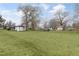 Large backyard with green grass and detached shed at 521 Mill St, Smithfield, NC 27577