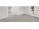 Simple bedroom with gray carpeting and neutral walls at 521 Mill St, Smithfield, NC 27577