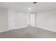Simple bedroom with gray carpet and access to another room at 521 Mill St, Smithfield, NC 27577