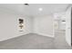 Bright and spacious bedroom with new carpet and neutral walls at 521 Mill St, Smithfield, NC 27577