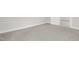 Simple bedroom with gray carpet and an open door at 521 Mill St, Smithfield, NC 27577