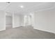 Bright hallway with gray carpet and access to other rooms at 521 Mill St, Smithfield, NC 27577