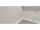 Small laundry room with vinyl flooring and built-in shelving at 521 Mill St, Smithfield, NC 27577