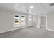 Bright and airy living room with gray carpeting and ample natural light at 521 Mill St, Smithfield, NC 27577