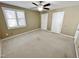 Bright bedroom with ceiling fan and window at 5718 Sentinel Dr, Raleigh, NC 27609