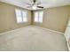 Bright bedroom with ceiling fan and window at 5718 Sentinel Dr, Raleigh, NC 27609