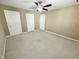Bright bedroom with ceiling fan and window at 5718 Sentinel Dr, Raleigh, NC 27609