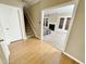 Bright entryway with hardwood floors and view of living room at 5718 Sentinel Dr, Raleigh, NC 27609