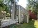 Exterior shot showcasing two-story design with neutral siding and a welcoming deck at 5718 Sentinel Dr, Raleigh, NC 27609