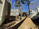 View of backyard with deck and part of neighboring houses at 5718 Sentinel Dr, Raleigh, NC 27609