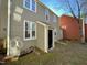 Side view of house showing storage unit and part of neighboring house at 5718 Sentinel Dr, Raleigh, NC 27609