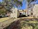 Tan colored house exterior with yard, white fence and landscaping at 5718 Sentinel Dr, Raleigh, NC 27609