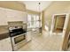 Bright kitchen with white cabinets, stainless steel appliances, and breakfast nook at 5718 Sentinel Dr, Raleigh, NC 27609