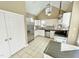 Kitchen boasts white cabinets, stainless steel appliances, and a breakfast bar at 5718 Sentinel Dr, Raleigh, NC 27609